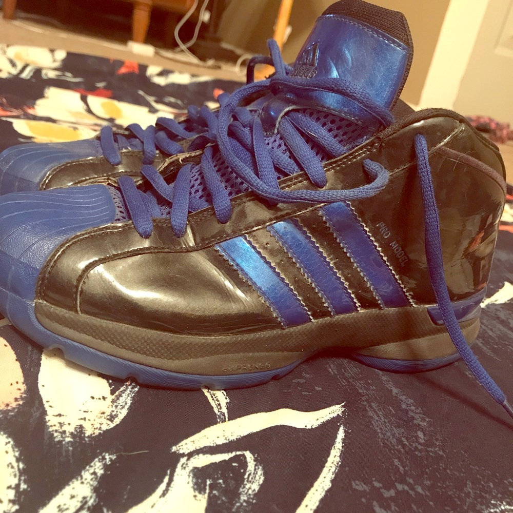 Black and blue Adidas basketball shoes